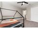 Bedroom featuring a decorative bed, a ceiling fan, and a view to the staircase at 289 Magnolia Park Trl, Sanford, FL 32773