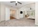 Open bedroom with an arched entryway, French doors, ceiling fan, and expansive space at 289 Magnolia Park Trl, Sanford, FL 32773