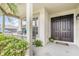 Inviting front porch with seating area, complemented by a double door entryway at 289 Magnolia Park Trl, Sanford, FL 32773