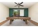 Game room featuring a pool table beneath a ceiling fan next to a window providing natural light at 289 Magnolia Park Trl, Sanford, FL 32773