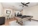 Open concept living space including a game room with pool table, dining area, and kitchen at 289 Magnolia Park Trl, Sanford, FL 32773