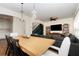 Open-concept living and dining area featuring hardwood floors and a connecting staircase at 289 Magnolia Park Trl, Sanford, FL 32773