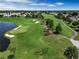 Aerial view of the golf course with lush green fairways and ponds at 3004 Cottage Grove Ct # 1805, Orlando, FL 32822