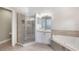 Modern bathroom with a shower, soaking tub and neutral color scheme at 3004 Cottage Grove Ct # 1805, Orlando, FL 32822