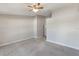 View of bedroom with neutral walls, ceiling fan, and carpeted floors at 3004 Cottage Grove Ct # 1805, Orlando, FL 32822