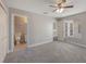 Carpeted bedroom with en suite bath, double door closet and ceiling fan at 3004 Cottage Grove Ct # 1805, Orlando, FL 32822