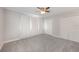 Bedroom with carpeted floors and a pair of double door closets and neutral colors at 3004 Cottage Grove Ct # 1805, Orlando, FL 32822