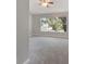 Spacious carpeted bedroom with ceiling fan and large window at 3004 Cottage Grove Ct # 1805, Orlando, FL 32822
