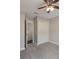 View of bedroom with carpeted floors, a double door closet and ceiling fan at 3004 Cottage Grove Ct # 1805, Orlando, FL 32822
