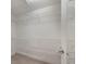 Spacious walk-in closet featuring white walls, white shelving and neutral colored flooring at 3004 Cottage Grove Ct # 1805, Orlando, FL 32822