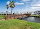 Scenic community view featuring a bridge and lush landscaping, perfect for enjoying waterfront living at 3004 Cottage Grove Ct # 1805, Orlando, FL 32822