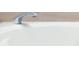 Close up of a bathtub faucet with neutral colored backsplash at 3004 Cottage Grove Ct # 1805, Orlando, FL 32822