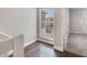 Hallway with hardwood floors and a street-facing window at 3004 Cottage Grove Ct # 1805, Orlando, FL 32822