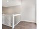 Hallway with hardwood floors and white railing at 3004 Cottage Grove Ct # 1805, Orlando, FL 32822