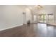 Open living room featuring hardwood floors, recessed lights, fireplace, and sliding glass doors to the outdoors at 3004 Cottage Grove Ct # 1805, Orlando, FL 32822
