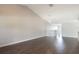 Open living area with hardwood floors, vaulted ceilings and recessed lighting, leading to the upstairs and kitchen at 3004 Cottage Grove Ct # 1805, Orlando, FL 32822