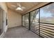 Well-lit, screened in patio featuring an outdoor ceiling fan and black horizontal bars at 3004 Cottage Grove Ct # 1805, Orlando, FL 32822