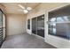 Screened in patio with outdoor ceiling fan, neutral colored carpet and lots of natural light at 3004 Cottage Grove Ct # 1805, Orlando, FL 32822