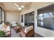 Screened in lanai furnished with patio seating and ceiling fan at 3004 Cottage Grove Ct # 1805, Orlando, FL 32822