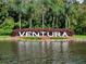 Ventura community entrance sign with colorful landscaping and water feature at 3004 Cottage Grove Ct # 1805, Orlando, FL 32822