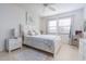 Serene bedroom with soft white color scheme, comfortable bed, and natural light at 3221 Westridge Blvd # 103, Orlando, FL 32822
