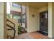 Inviting entrance to the home with tiled flooring, and a potted plant by the front door at 3221 Westridge Blvd # 103, Orlando, FL 32822