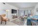 Inviting living area with a modern TV, stylish decor, and comfortable seating at 3221 Westridge Blvd # 103, Orlando, FL 32822