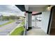 Outdoor balcony with views of the parking lot and surrounding neighborhood buildings at 3702 Palm Desert Ln # 5435, Orlando, FL 32839