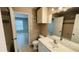 Bathroom with updated vanity and mirror, adjacent to bedroom at 3702 Palm Desert Ln # 5435, Orlando, FL 32839