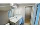 Bathroom with a walk-in closet and single sink vanity with storage at 3702 Palm Desert Ln # 5435, Orlando, FL 32839