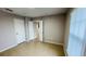 Spacious bedroom with tile floors, neutral paint, and multiple doorways at 3702 Palm Desert Ln # 5435, Orlando, FL 32839