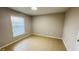 A cozy bedroom featuring tile flooring and ample natural light from the window at 3702 Palm Desert Ln # 5435, Orlando, FL 32839