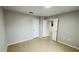 Bedroom with neutral walls, tile flooring, and access to other rooms at 3702 Palm Desert Ln # 5435, Orlando, FL 32839