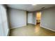 Spacious bedroom with neutral walls, tile flooring, and access to a bathroom at 3702 Palm Desert Ln # 5435, Orlando, FL 32839