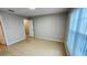 A cozy bedroom with tile floors, a closet, and bright window at 3702 Palm Desert Ln # 5435, Orlando, FL 32839