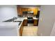 Open kitchen with tile floors and stainless steel appliances at 3702 Palm Desert Ln # 5435, Orlando, FL 32839