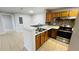 Well lit kitchen with stainless steel appliances and mosaic tile backsplash at 3702 Palm Desert Ln # 5435, Orlando, FL 32839