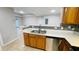 Galley kitchen with stone countertops and stainless steel dishwasher at 3702 Palm Desert Ln # 5435, Orlando, FL 32839