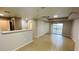 Open floor plan with living area, kitchen bar, and sliding doors to a balcony at 3702 Palm Desert Ln # 5435, Orlando, FL 32839