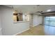 Bright, open living space with tile floors, neutral walls, and access to an outdoor balcony at 3702 Palm Desert Ln # 5435, Orlando, FL 32839