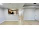 Spacious open-concept living area with a view of the kitchen, tile floors and neutral paint at 3702 Palm Desert Ln # 5435, Orlando, FL 32839