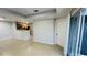 Open-concept living area with tile floors, kitchen bar, and sliding door access to the balcony at 3702 Palm Desert Ln # 5435, Orlando, FL 32839