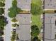 Aerial view of townhomes showing roof lines and grassy areas between buildings at 3759 Collingwood Ln, Oviedo, FL 32765