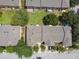 Aerial view of townhomes with well-maintained roofs and green space in a community setting at 3759 Collingwood Ln, Oviedo, FL 32765