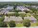 Aerial view showcasing a residential community with well-maintained landscaping and convenient access to nearby commercial areas at 3759 Collingwood Ln, Oviedo, FL 32765