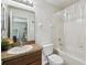A clean, functional bathroom with a shower-tub combo and a vanity with a mirror at 3759 Collingwood Ln, Oviedo, FL 32765
