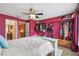 Cozy bedroom with brightly painted built in storage and access to the bathroom at 3759 Collingwood Ln, Oviedo, FL 32765