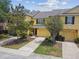 Charming townhome boasts a sunny facade, well-maintained landscaping, and a convenient attached garage at 3759 Collingwood Ln, Oviedo, FL 32765