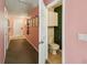 Hallway leading to a bathroom with unique green wall decor at 3759 Collingwood Ln, Oviedo, FL 32765