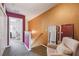 Upstairs hallway with decorative paint scheme and a cozy seating area at 3759 Collingwood Ln, Oviedo, FL 32765